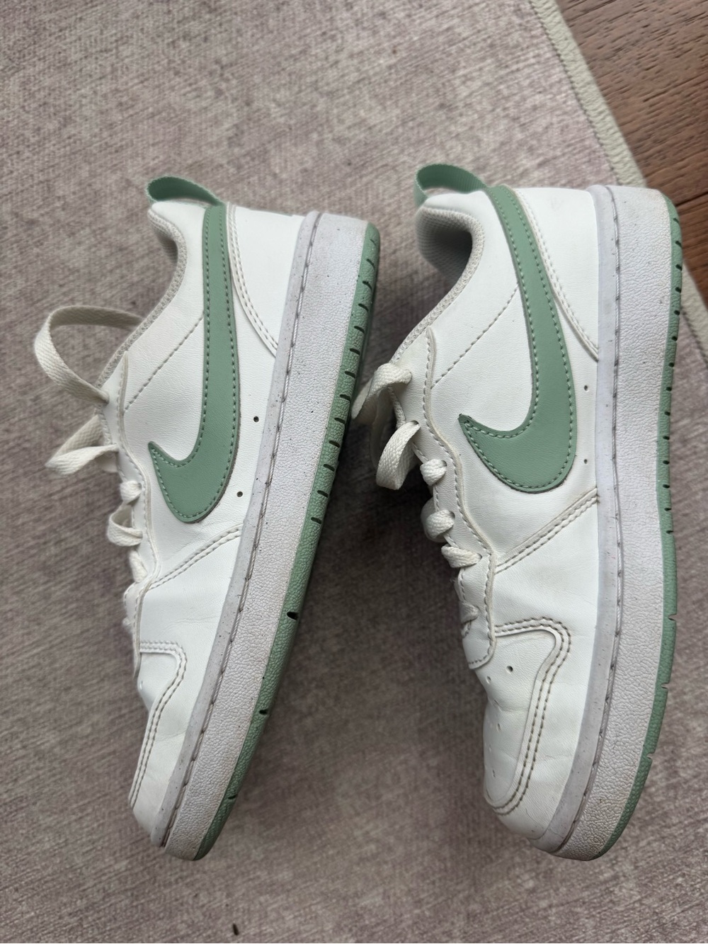 Gently used Nike Court Borough Sneakers with Green Swoosh for girls. Size 3.5 US